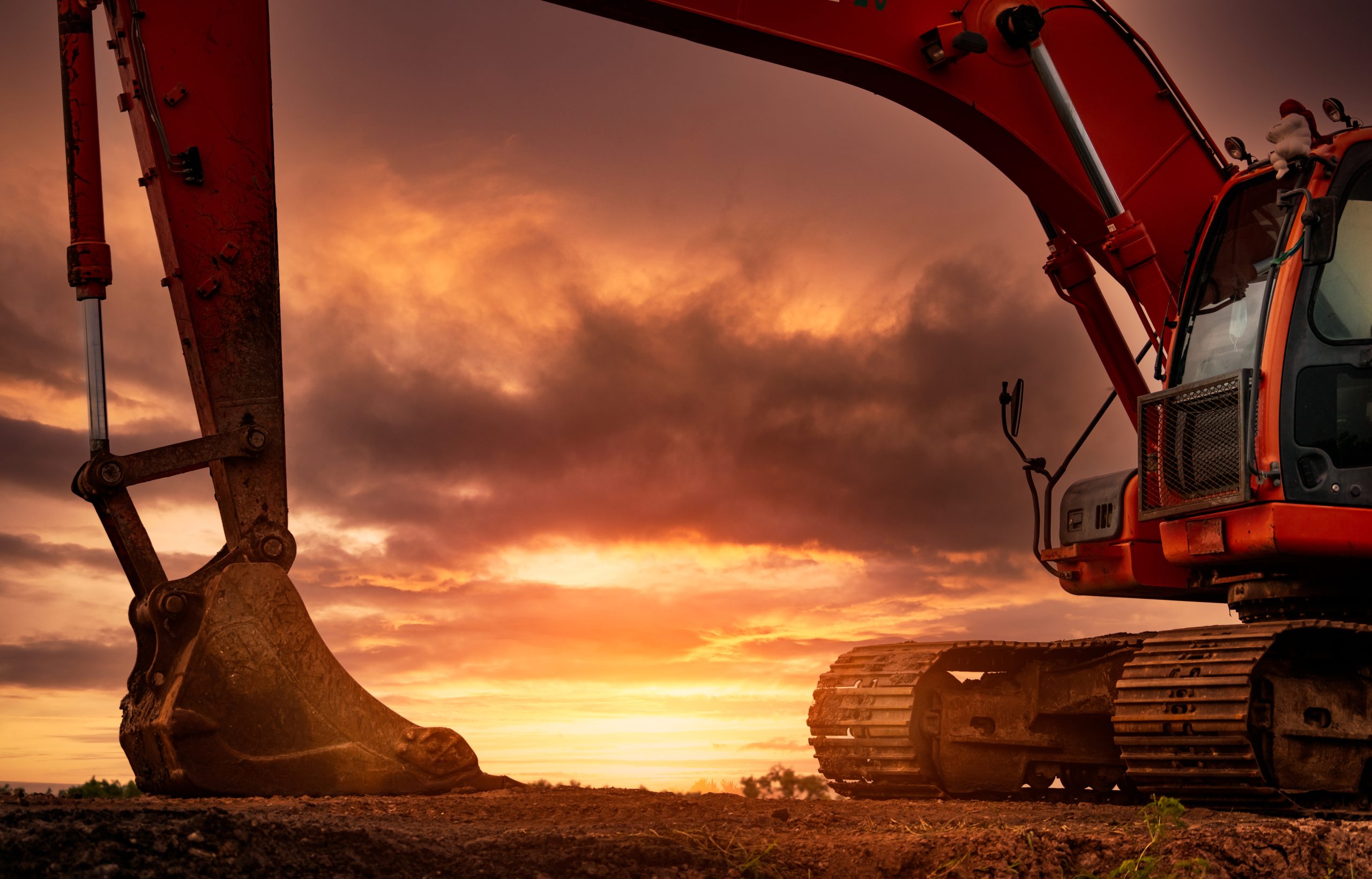 backhoe parked at construction site after digging soil. bulldoze
